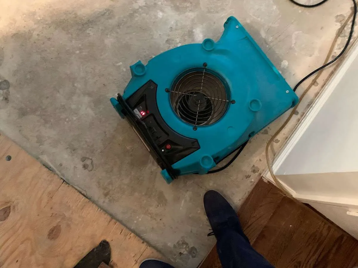 Air mover drying subfloor during Leak Detection & Repair in Dayton